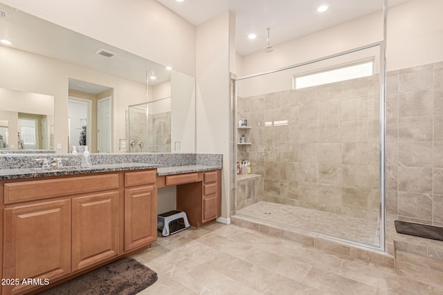 bathroom featuring a shower stall, vanity, and recessed lighting