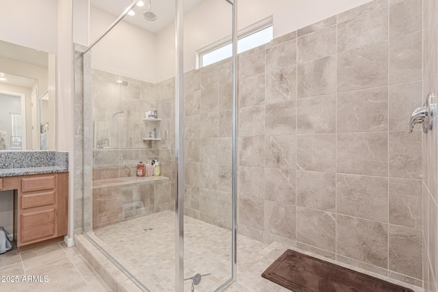 full bathroom featuring a shower stall, vanity, and tile patterned floors