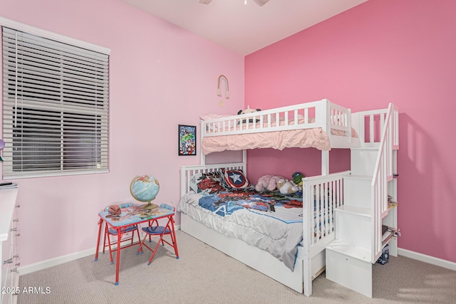 carpeted bedroom featuring baseboards