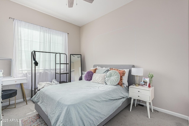 bedroom with carpet flooring, baseboards, and ceiling fan