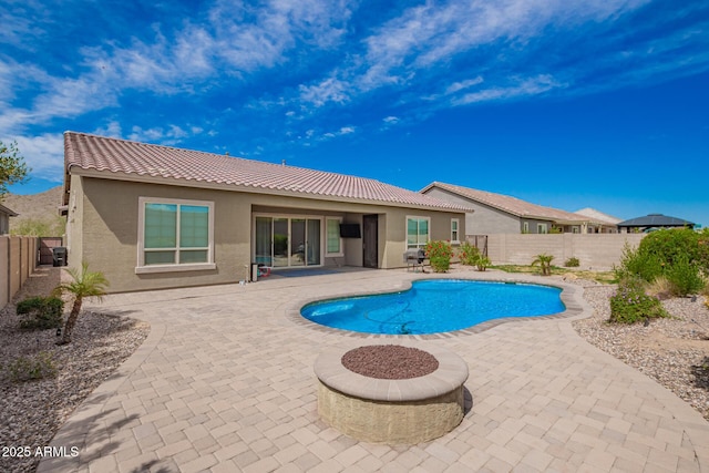 view of swimming pool featuring a fenced backyard and a patio