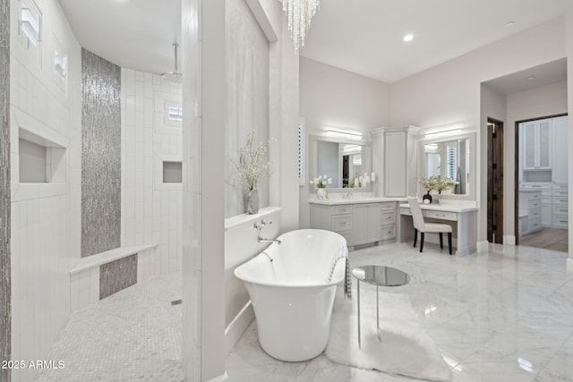 13750 E Yucca St, Scottsdale, AZ 85259 - full bathroom with a walk in shower, a freestanding bath, vanity, marble finish floors, and recessed lighting