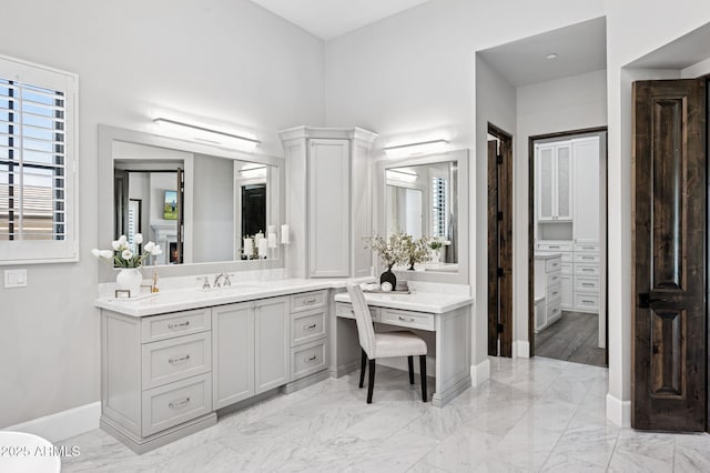 13750 E Yucca St, Scottsdale, AZ 85259 - bathroom featuring vanity, marble finish floors, and baseboards