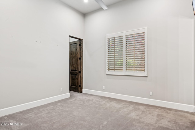13750 E Yucca St, Scottsdale, AZ 85259 - carpeted empty room with baseboards and a towering ceiling