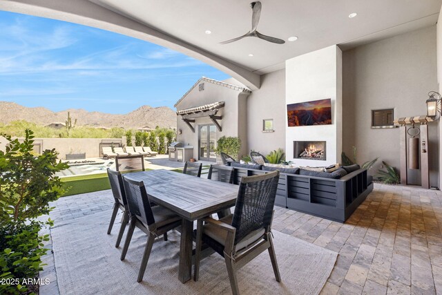 13750 E Yucca St, Scottsdale, AZ 85259 - view of patio featuring an outdoor living space with a fireplace, outdoor dining area, french doors, and ceiling fan