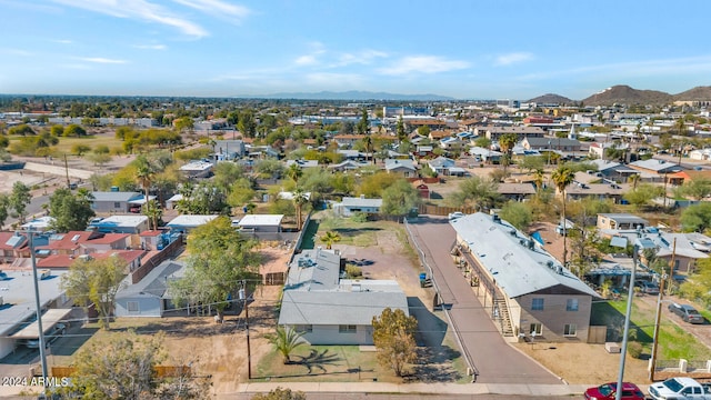 birds eye view of property featuring a mountain view