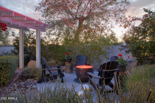 patio terrace at dusk with a pergola