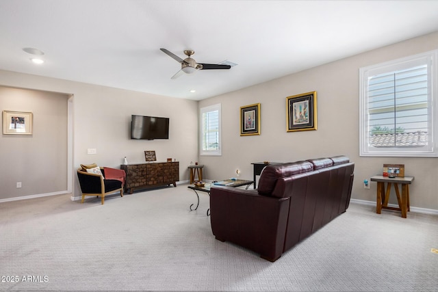 living room featuring ceiling fan and light colored carpet