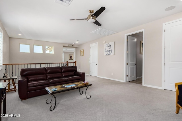 living room featuring light carpet and ceiling fan