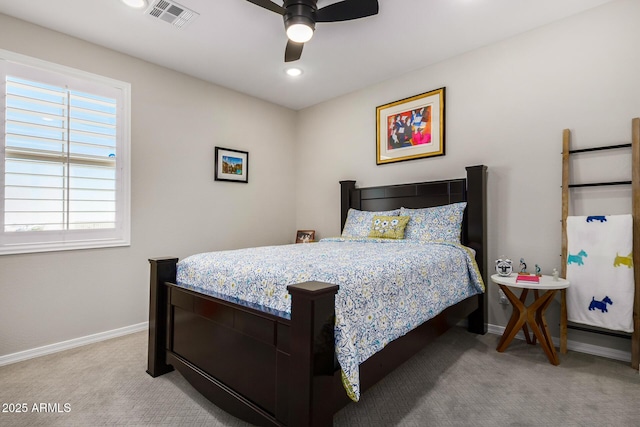 bedroom with ceiling fan and light colored carpet