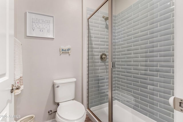 bathroom with walk in shower and toilet