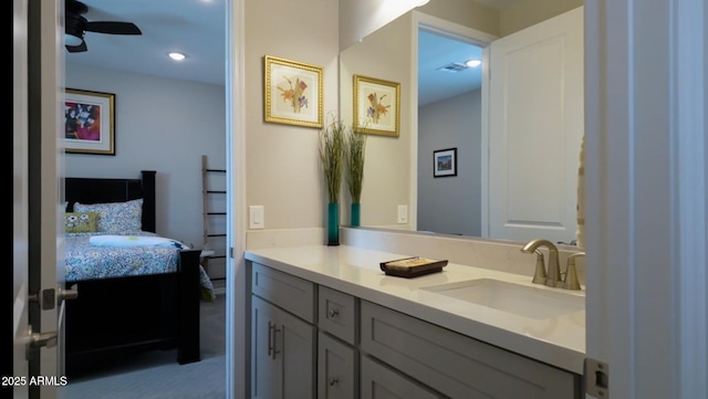 bathroom featuring ceiling fan and vanity