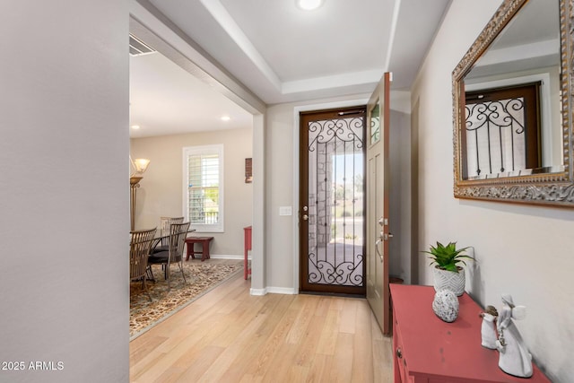 entryway with light hardwood / wood-style flooring