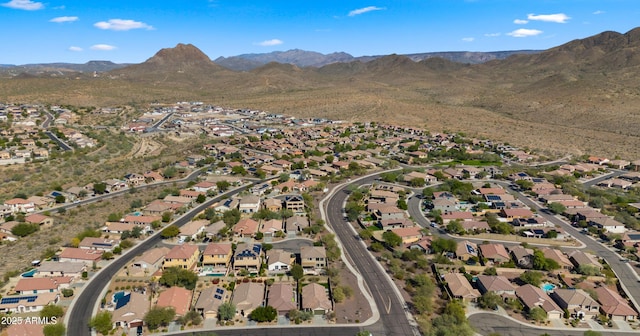 drone / aerial view featuring a residential view and a mountain view