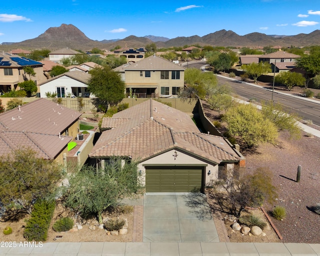 drone / aerial view featuring a residential view and a mountain view