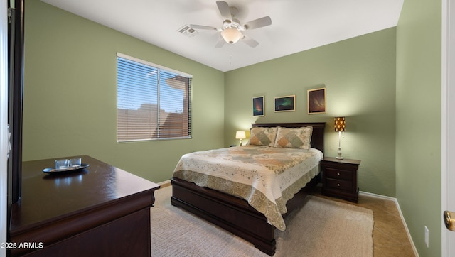 tiled bedroom featuring baseboards, visible vents, and a ceiling fan