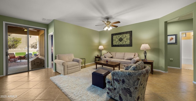 living room featuring ceiling fan, tile patterned flooring, visible vents, and baseboards