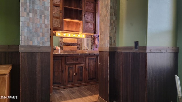 bathroom with vanity, tasteful backsplash, and hardwood / wood-style flooring