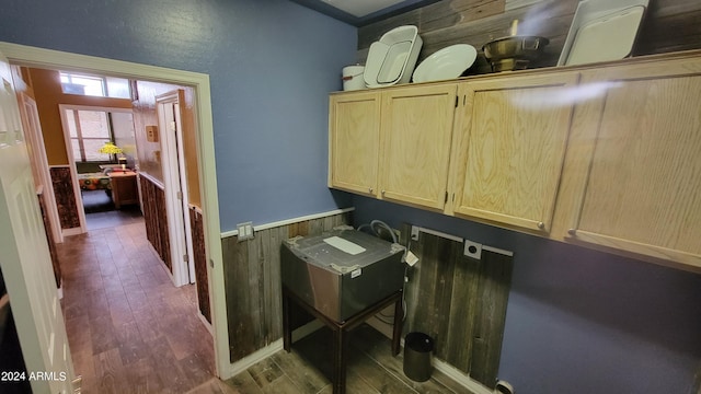 laundry area with cabinets, hookup for an electric dryer, and wood-type flooring