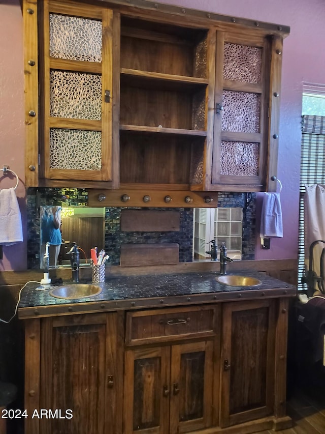 kitchen featuring sink and tasteful backsplash