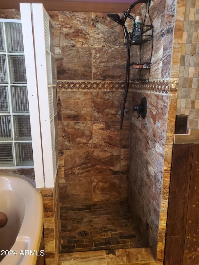 bathroom with separate shower and tub