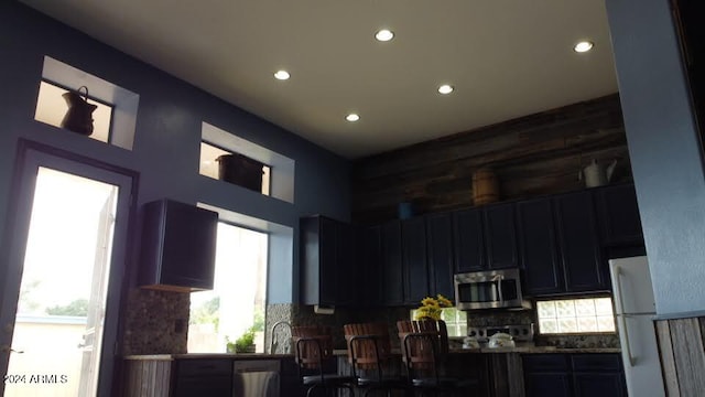 interior space featuring appliances with stainless steel finishes and backsplash