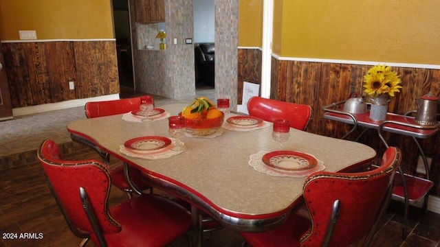 dining room with dark hardwood / wood-style floors