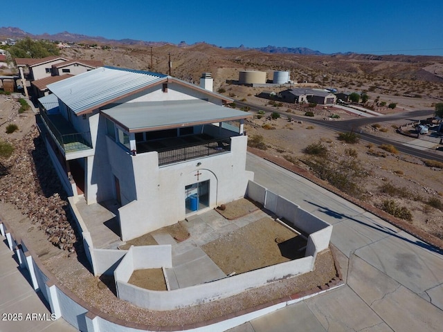 birds eye view of property with a mountain view