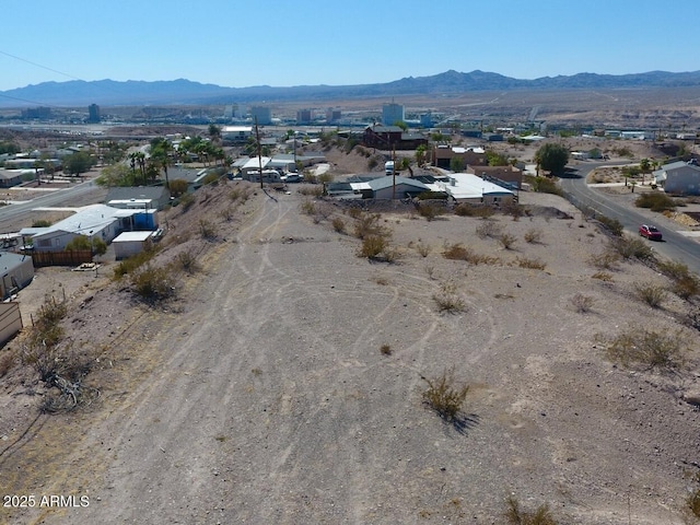 birds eye view of property featuring a mountain view