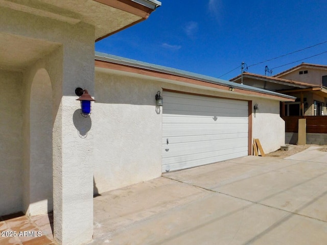 exterior space with concrete driveway