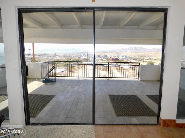 view of patio / terrace with a mountain view