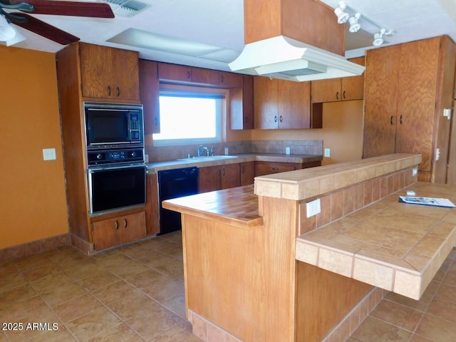 kitchen with light tile patterned floors, a sink, visible vents, brown cabinets, and black appliances