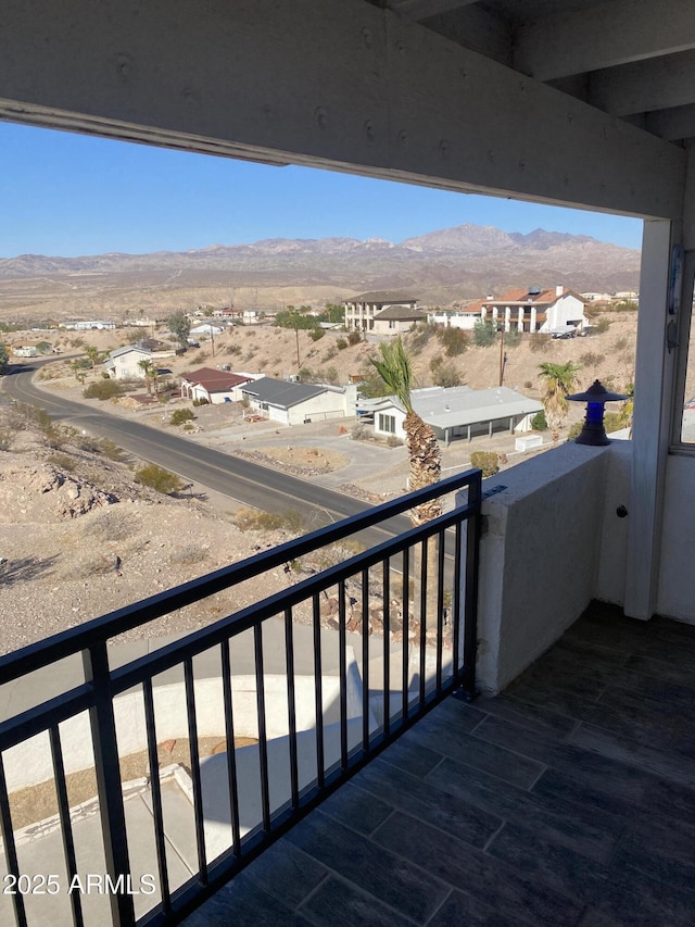 balcony with a residential view and a mountain view