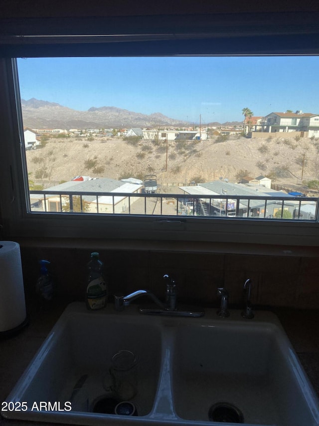 details with a mountain view and a sink