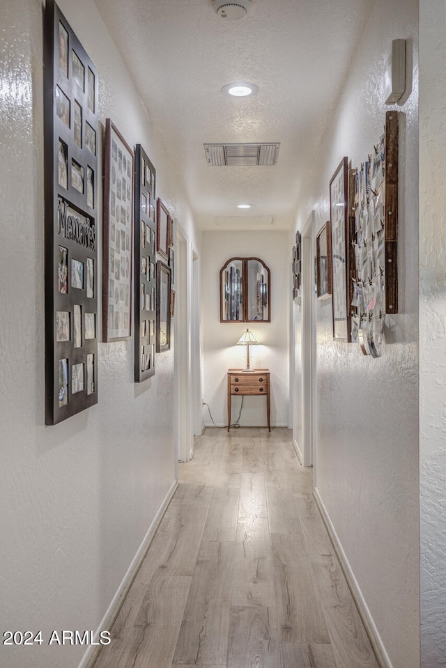 hall featuring light hardwood / wood-style floors