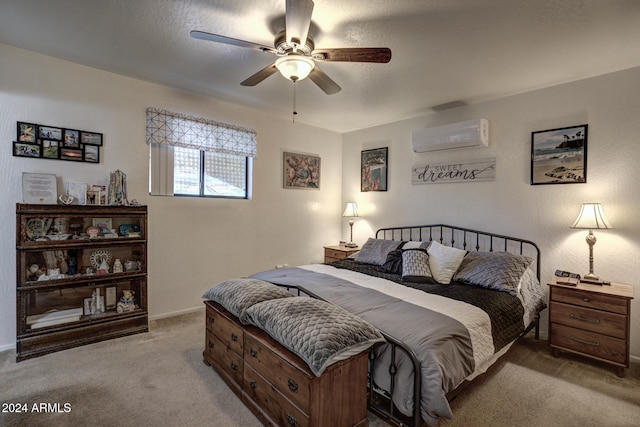 carpeted bedroom featuring an AC wall unit and ceiling fan