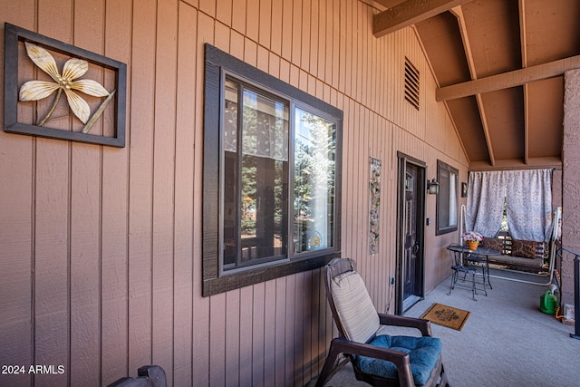 view of exterior entry featuring a porch