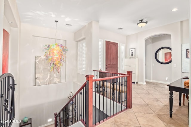 hallway featuring light tile patterned floors