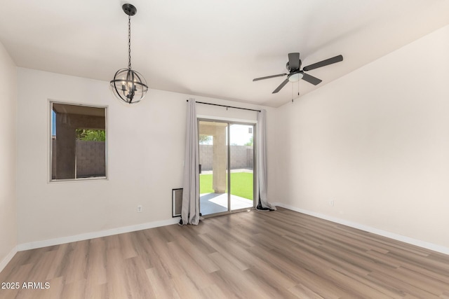 30212 N Sunray Dr, San Tan Valley, AZ 85143 - empty room featuring light wood-type flooring, a chandelier, baseboards, and ceiling fan