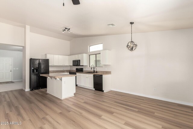 30212 N Sunray Dr, San Tan Valley, AZ 85143 - kitchen featuring black appliances, white cabinetry, a sink, baseboards, and a center island