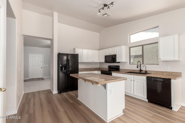 30212 N Sunray Dr, San Tan Valley, AZ 85143 - kitchen featuring black appliances, a sink, high vaulted ceiling, white cabinetry, and a kitchen island