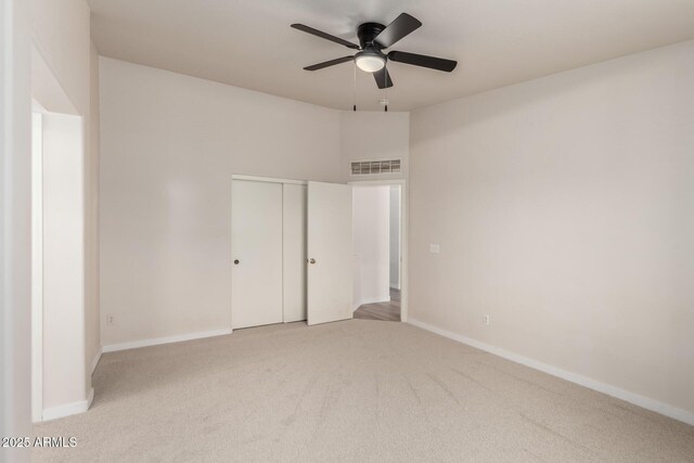 30212 N Sunray Dr, San Tan Valley, AZ 85143 - unfurnished bedroom with carpet flooring, baseboards, a closet, and ceiling fan