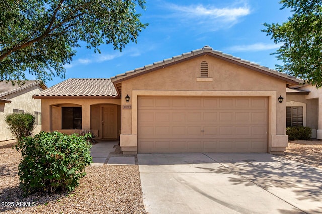 30212 N Sunray Dr, San Tan Valley, AZ 85143 - view of front of house featuring a tiled roof, stucco siding, a garage, and concrete driveway