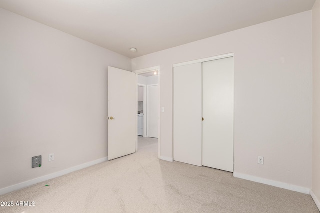 30212 N Sunray Dr, San Tan Valley, AZ 85143 - unfurnished bedroom featuring carpet, baseboards, a closet, and washer / dryer