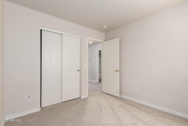 30212 N Sunray Dr, San Tan Valley, AZ 85143 - unfurnished bedroom featuring carpet, baseboards, and a closet