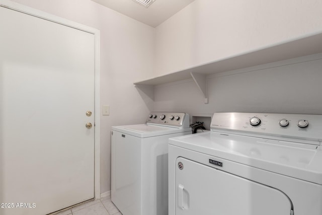 30212 N Sunray Dr, San Tan Valley, AZ 85143 - laundry area with washer and clothes dryer and light tile patterned floors
