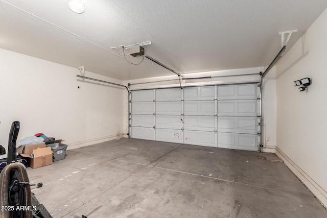30212 N Sunray Dr, San Tan Valley, AZ 85143 - garage with baseboards and a garage door opener