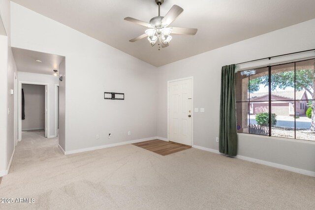 30212 N Sunray Dr, San Tan Valley, AZ 85143 - unfurnished room featuring light carpet, vaulted ceiling, baseboards, and ceiling fan
