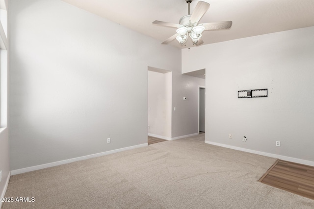 30212 N Sunray Dr, San Tan Valley, AZ 85143 - carpeted empty room featuring ceiling fan, vaulted ceiling, and baseboards