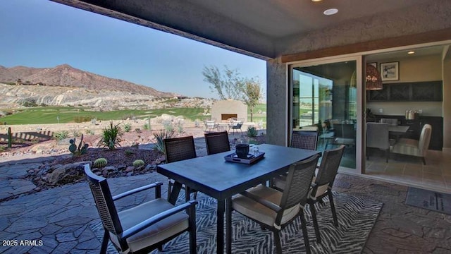 20723 W San Miguel Ave, Buckeye, AZ 85396 - view of patio / terrace featuring outdoor dining space and a mountain view